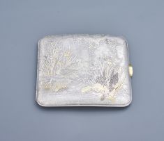 A Japanese white metal and gilt cigarette case