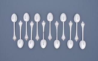 A cased set of twelve Victorian silver teaspoons, Thomas Bradbury & Sons, London, 1897, Britannia standard, retailed by Charles Harris