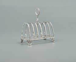 A Victorian silver toast rack, maker's mark *G, Birmingham, 1899