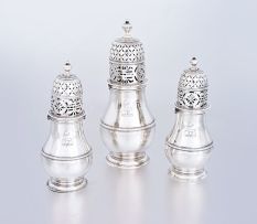 A set of three Queen Anne silver casters, Charles Adam, London, 1713