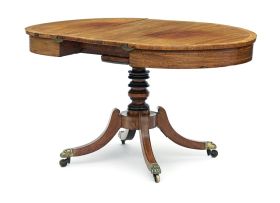 A Regency mahogany single pedestal extending table