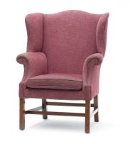 A George III mahogany and upholstered wingback armchair