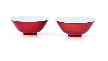 A near pair of Chinese copper-red glazed bowls, Qing Dynasty, 18th/19th century