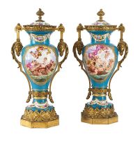 A pair of 'Sèvres' style gilt-metal-mounted two-handled vases and covers, late 19th century
