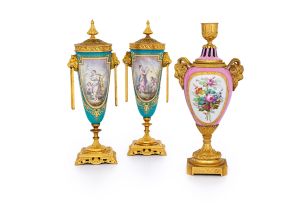 A pair of 'Sèvres' style gilt-metal-mounted porcelain urns and covers, late 19th century