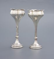 A pair of silver tulip-shaped vases, Henry Matthews, Birmingham, date mark worn