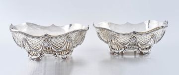 A pair of George III silver bread baskets, Thomas Robins, London, 1812, with Sheffield plate liners