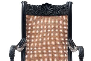 A Ceylonese ebonised and caned armchair, 19th century