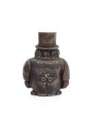 A cast iron money box in the form of Paul Kruger wearing a top hat, inscribed Transvaal Money Box, circa 1950