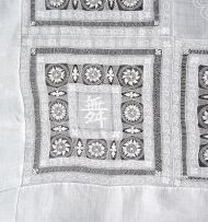 A Chinese embroidered linen and cotton bedspread, circa 1910
