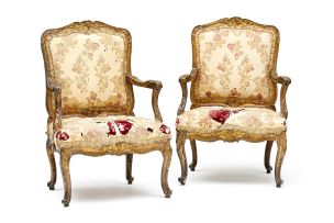 A pair of George III style giltwood and upholstered armchairs, 19th century