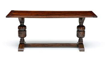 A late Victorian oak trestle table