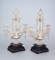 A pair of Victorian silver-plate two-light candelabra