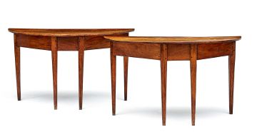 A pair of fruitwood half-moon tables, first quarter 19th century