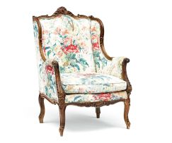 A French upholstered and walnut bergère