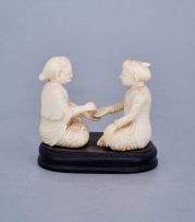 An Indian ivory carving of a palm reader, first half 20th century