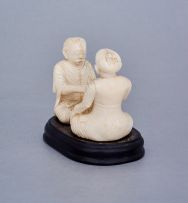 An Indian ivory carving of a palm reader, first half 20th century