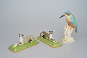 A pair of Halcyon Days figures of recumbent greyhounds, modern