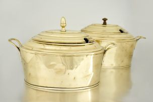 A pair of brass casserole dishes