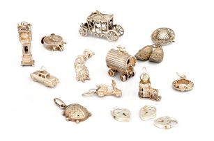 A miscellaneous group of seventeen silver and metal charms