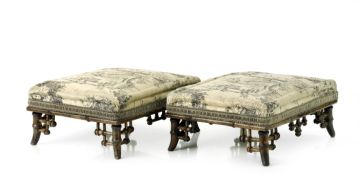 A pair of Edwardian silk-upholstered footstools