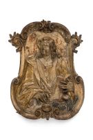 An Italian painted and gilt limewood relief of Saint John, 17th/18th century