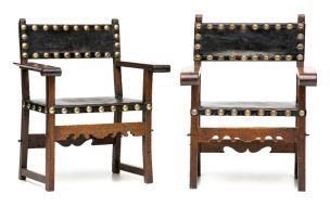 A pair of Baroque-style walnut and leather upholstered open armchairs, possibly Spanish, 19th century