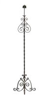 A wrought iron standing lamp