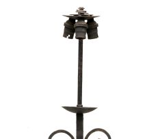 A wrought iron standing lamp