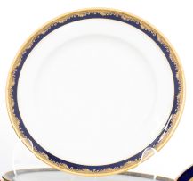 A set of twelve Limoges blue and gold dinner plates, retailed by J Pouyat, Limoges and W. Knittel, Breslau