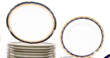 A set of twelve Limoges blue and gold dinner plates, retailed by J Pouyat, Limoges and W. Knittel, Breslau
