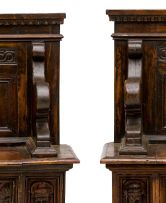 A pair of Italian walnut carved hall benches, 19th century
