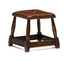 An oak and leather stool, 20th century
