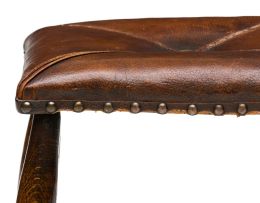 An oak and leather stool, 20th century