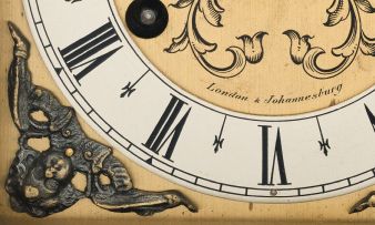 A bird's eye maple veneered table clock, Mappin & Webb, 20th century