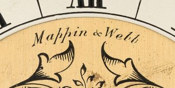 A bird's eye maple veneered table clock, Mappin & Webb, 20th century