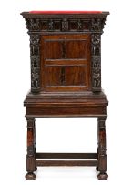 An Italian carved walnut and Bambocci cabinet, 18th century and later
