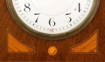 An Edwardian mahogany and inlaid mantel clock