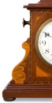 An Edwardian mahogany and inlaid mantel clock