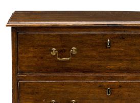 A George III style oak chest of drawers