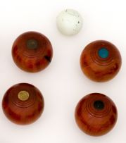 A set of eight carpet bowls