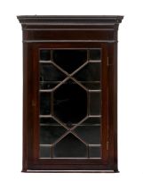 A George III style mahogany corner cupboard
