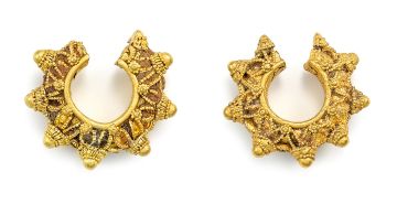 Pair of South-East Asian 20ct gold ear ornaments, 9th-12th century