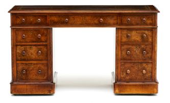 A Victorian walnut and walnut-veneered pedestal desk