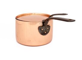 A copper saucepan and cover