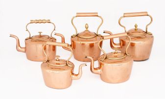 Five copper tea kettles