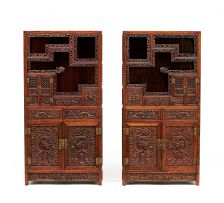 A pair of Chinese carved teak side cupboards, 20th century