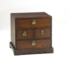 An oriental fruitwood miniature chest of drawers, early 20th century