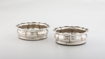 A pair of silver-plated wine coasters, 19th century