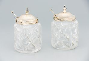 A pair of George VI glass and silver-mounted condiment jars and spoons, Alexander Clark & Co Limited, Birmingham, 1937 and 1945